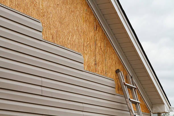Professional Storm Damage Siding Repair technician working in Brunswick, OH